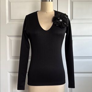 Elegant Black Long Sleeve Top with Floral Accent